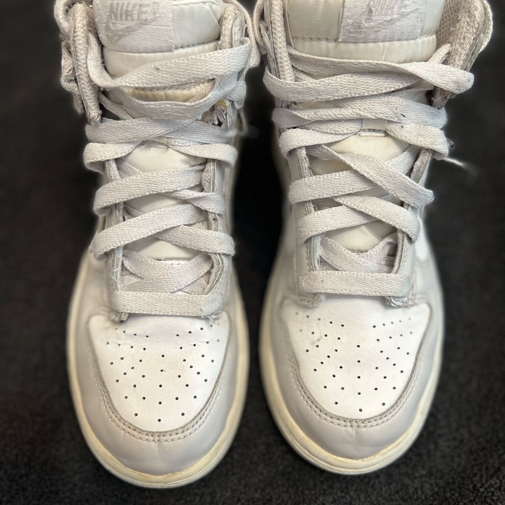 White Nike Air Force ones.